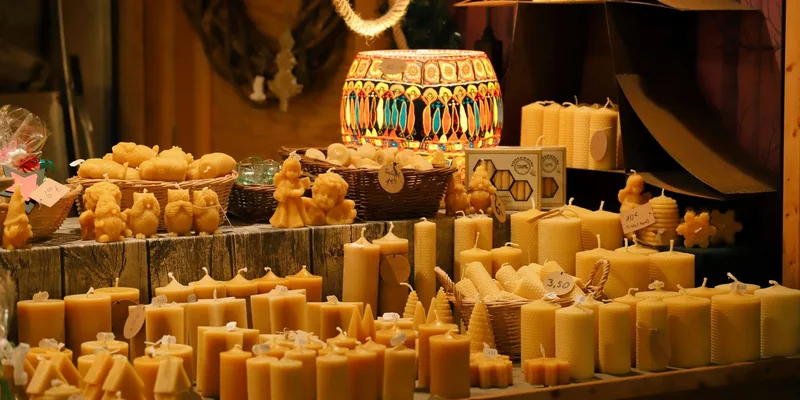 A delightful display of handmade beeswax candles at a Christmas market in Kassel, Germany